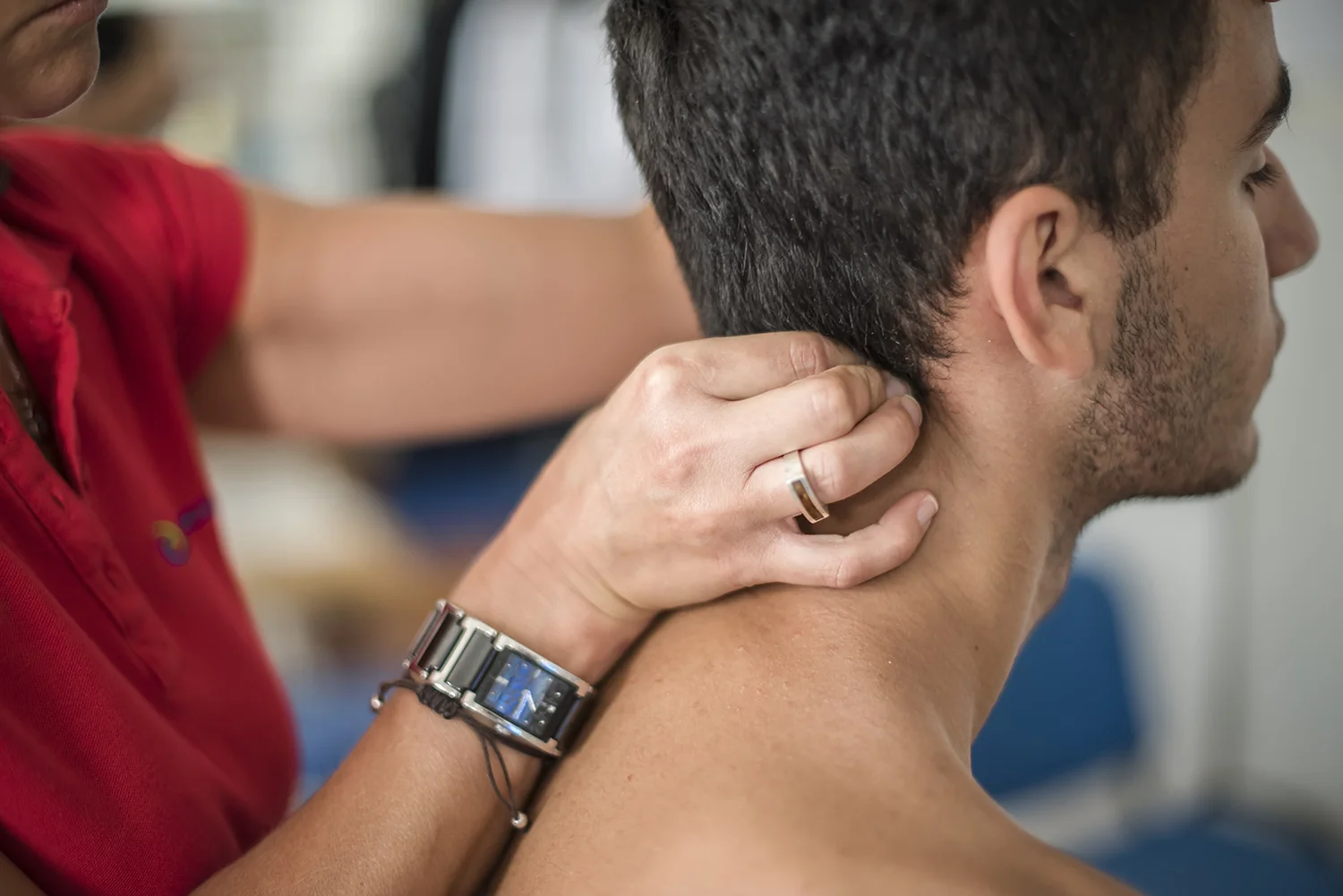 adult receiving neck massage at theray