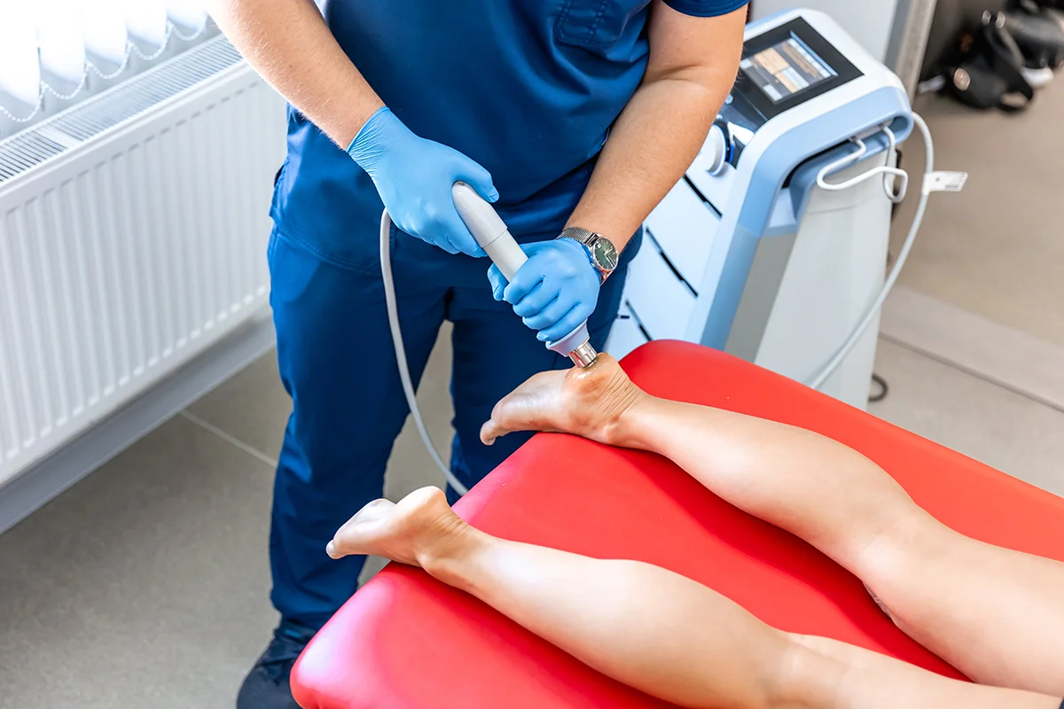 physical therapist treats patient s foot