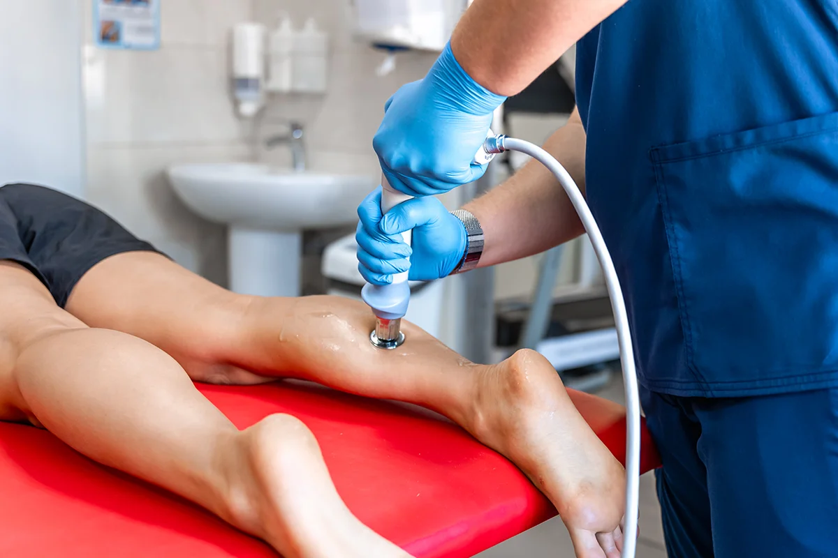 therapeutic treatment on leg at medical office