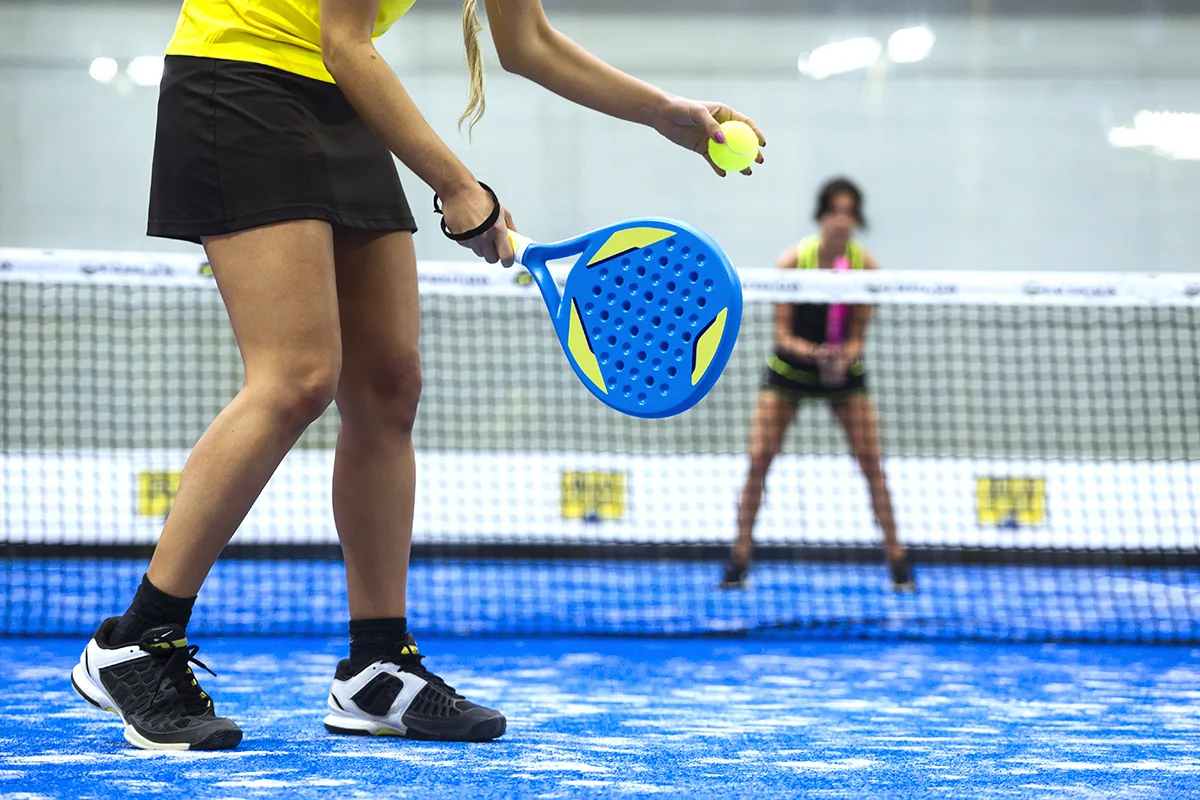 women playing paddle tennis